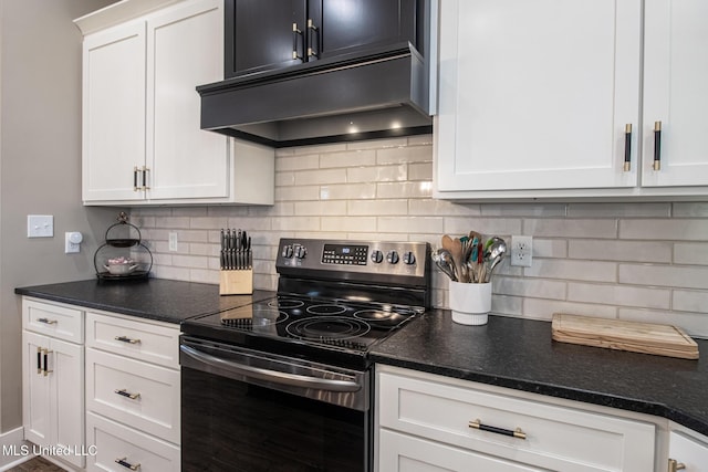 118 Sea Oaks Blvd, Long Beach, MS 39560 - kitchen with electric range, under cabinet range hood, white cabinets, and tasteful backsplash