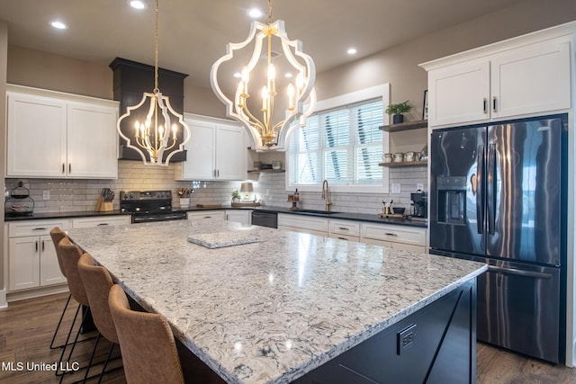 118 Sea Oaks Blvd, Long Beach, MS 39560 - kitchen with refrigerator with ice dispenser, electric stove, a chandelier, a sink, and open shelves