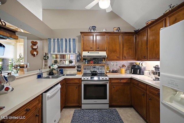 147 Lofty Pine Ln, Clinton, MS 39056 - kitchen with white appliances, range hood, vaulted ceiling, light countertops, and ceiling fan
