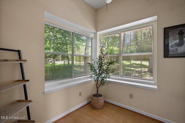 147 Lofty Pine Ln, Clinton, MS 39056 - unfurnished room with healthy amount of natural light, baseboards, and wood finished floors