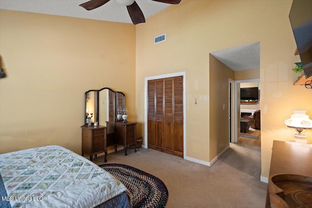 147 Lofty Pine Ln, Clinton, MS 39056 - bedroom featuring carpet, a closet, a high ceiling, baseboards, and a ceiling fan