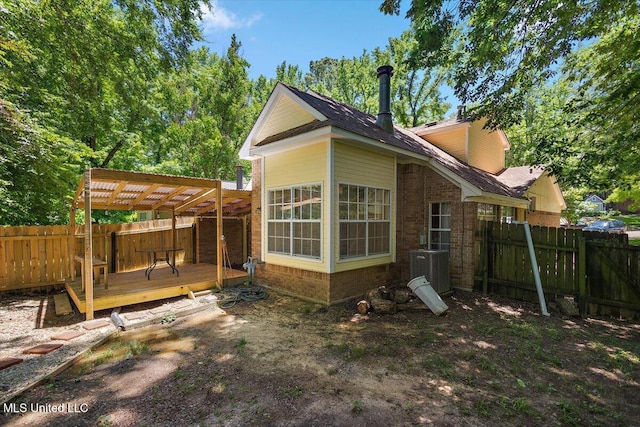 147 Lofty Pine Ln, Clinton, MS 39056 - back of property with a wooden deck, a fenced backyard, a pergola, cooling unit, and brick siding