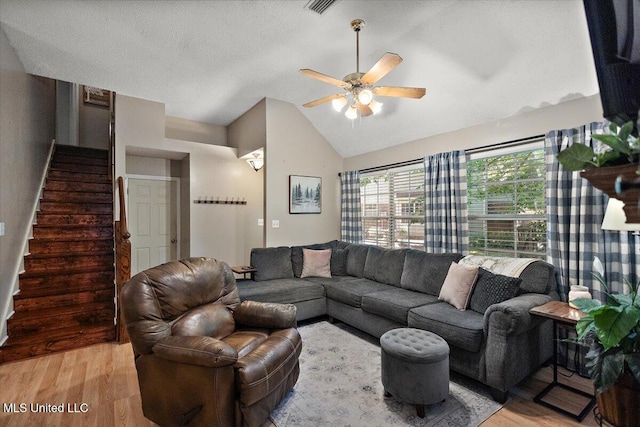 147 Lofty Pine Ln, Clinton, MS 39056 - living area with light wood-type flooring, lofted ceiling, a ceiling fan, and stairs