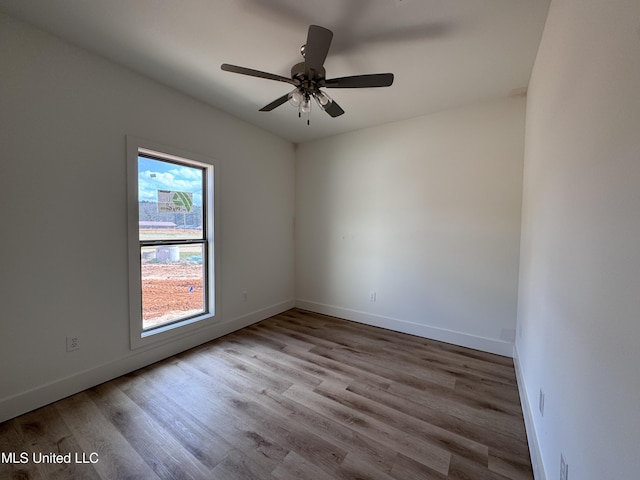 unfurnished room featuring ceiling fan and light hardwood / wood-style floors