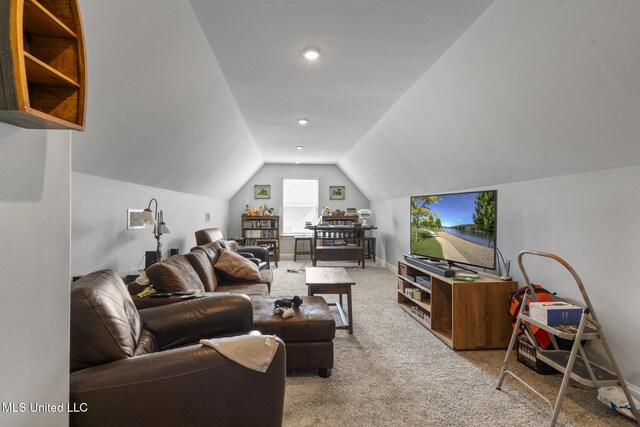 living room featuring light carpet, baseboards, and lofted ceiling