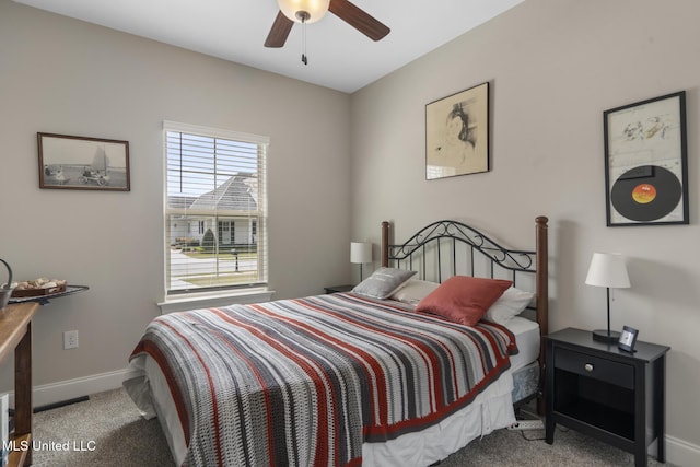 bedroom featuring a ceiling fan, baseboards, and carpet floors