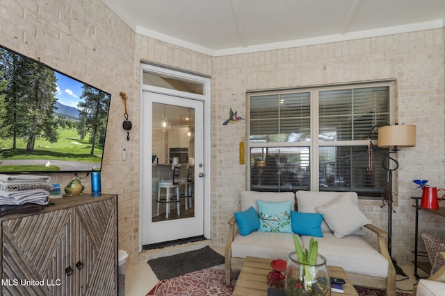 property entrance featuring brick siding