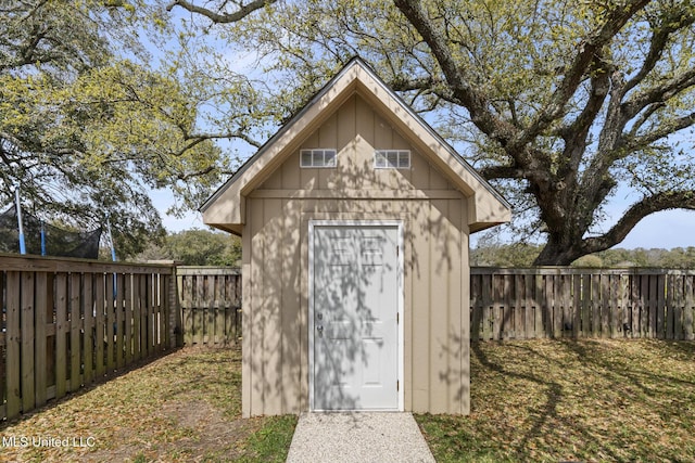 view of shed featuring a fenced backyard