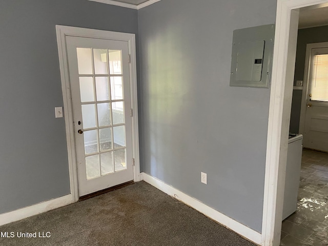 doorway with ornamental molding, electric panel, and dark colored carpet