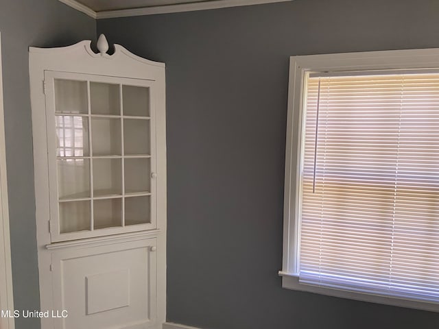 doorway featuring crown molding