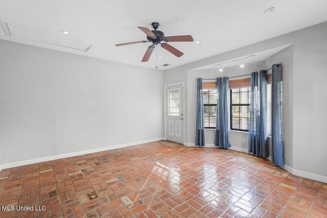 unfurnished room with ceiling fan