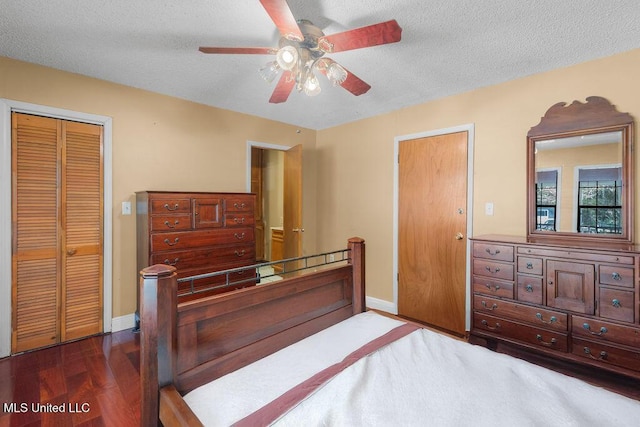 bedroom featuring ceiling fan, a closet, wood-type flooring, and a textured ceiling