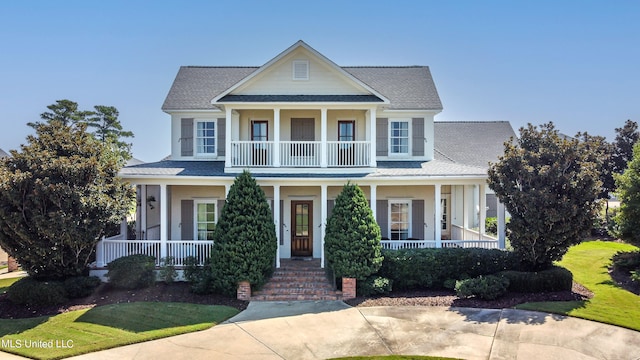 view of front of house featuring covered porch and a balcony