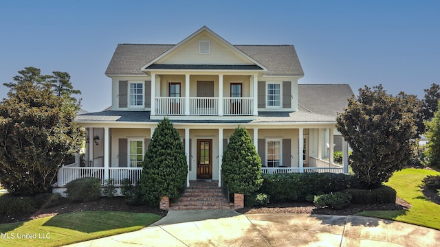 view of front facade featuring covered porch and a balcony