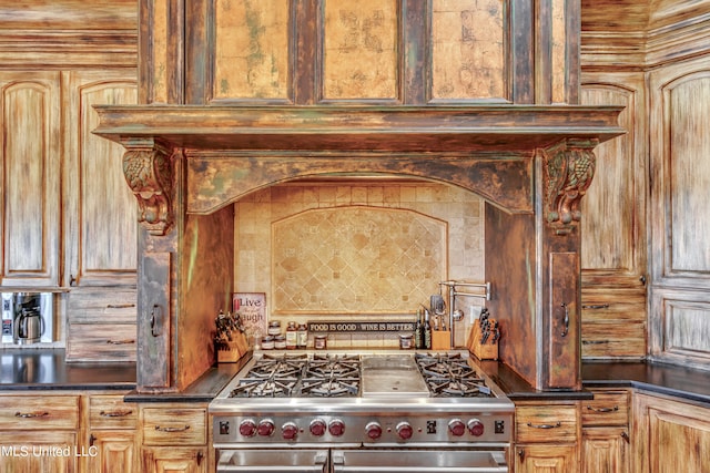 kitchen featuring backsplash and high end range