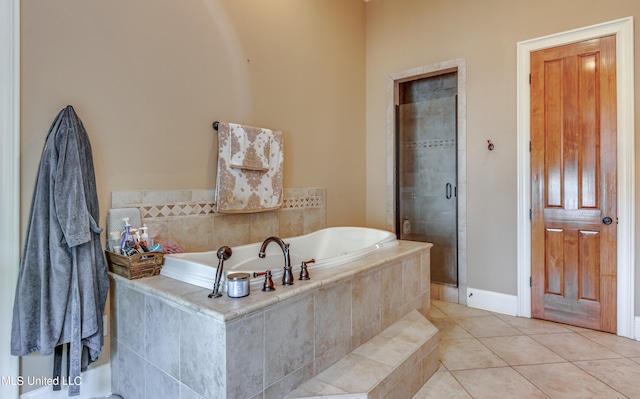 bathroom featuring tile patterned floors and separate shower and tub