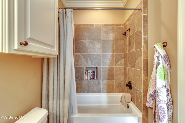 bathroom with toilet and shower / tub combo with curtain