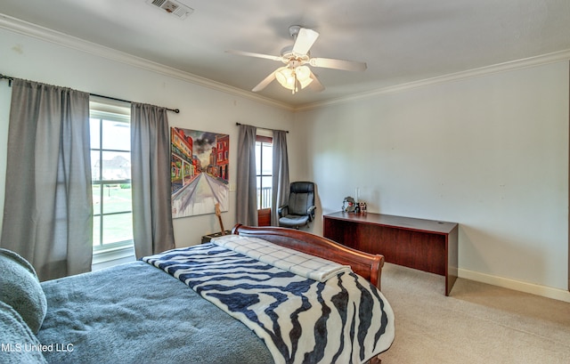 carpeted bedroom featuring multiple windows, crown molding, and ceiling fan