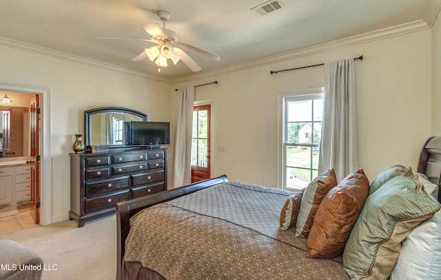 carpeted bedroom with crown molding, connected bathroom, and ceiling fan