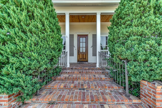 property entrance featuring covered porch