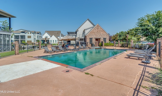 view of swimming pool with a patio