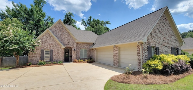 133 Sycamore Rdg, Madison, MS 39110 - view of front of property featuring brick siding, concrete driveway, an attached garage, and roof with shingles