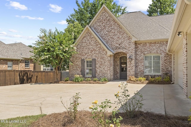 133 Sycamore Rdg, Madison, MS 39110 - french country inspired facade featuring brick siding and roof with shingles