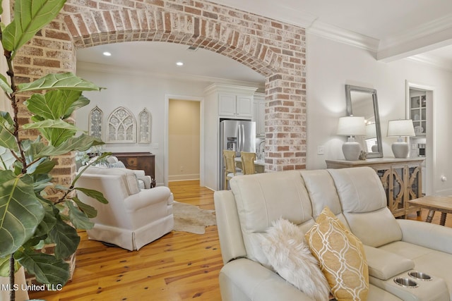 133 Sycamore Rdg, Madison, MS 39110 - living room with ornamental molding, light wood finished floors, arched walkways, and recessed lighting