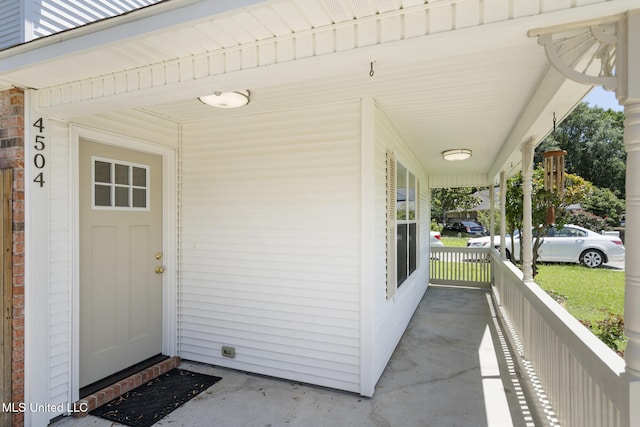 4504 E Magnolia Cv, Diberville, MS 39540 - doorway to property with covered porch