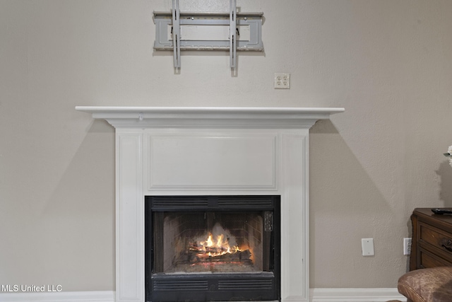 4504 E Magnolia Cv, Diberville, MS 39540 - detailed view of a warm lit fireplace