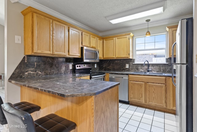4504 E Magnolia Cv, Diberville, MS 39540 - kitchen with appliances with stainless steel finishes, a sink, a peninsula, light tile patterned flooring, and backsplash