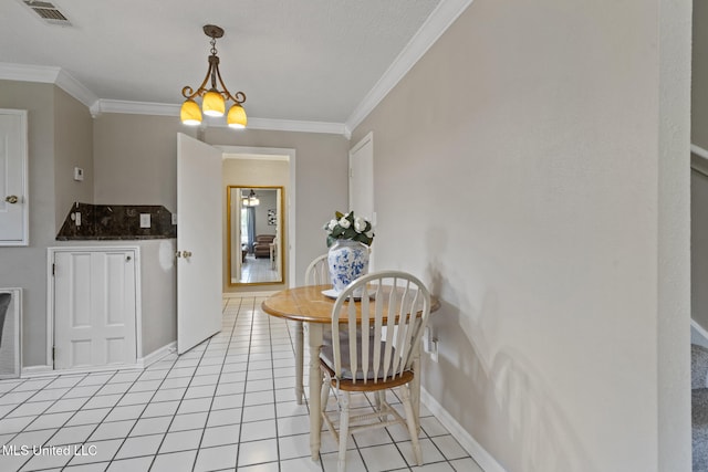 4504 E Magnolia Cv, Diberville, MS 39540 - dining space with ornamental molding, light tile patterned floors, baseboards, and a chandelier