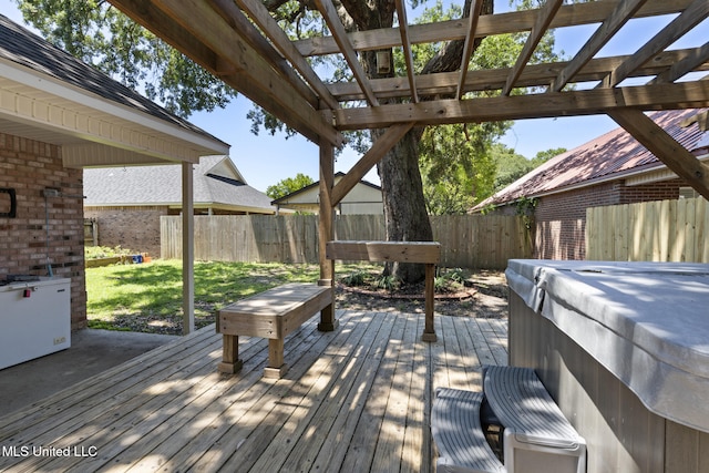 4504 E Magnolia Cv, Diberville, MS 39540 - wooden deck with a fenced backyard and a hot tub