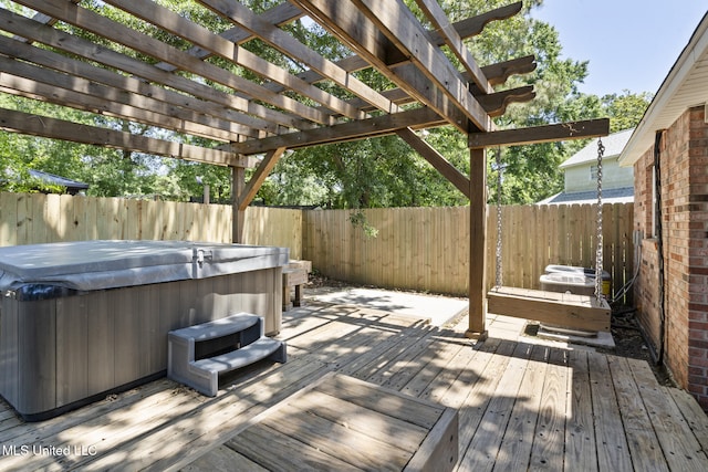 4504 E Magnolia Cv, Diberville, MS 39540 - deck featuring a hot tub, a fenced backyard, and a pergola
