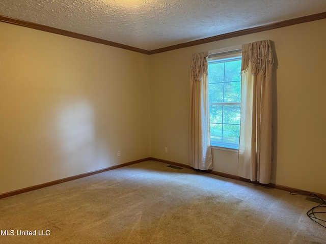 390 Green Rd, Yazoo City, MS 39194 - carpeted spare room with visible vents, baseboards, a textured ceiling, and crown molding