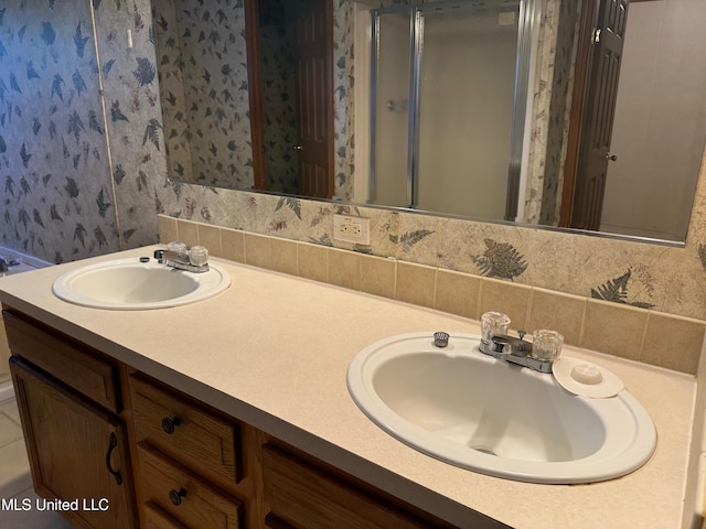 390 Green Rd, Yazoo City, MS 39194 - full bathroom featuring a sink, double vanity, and wallpapered walls