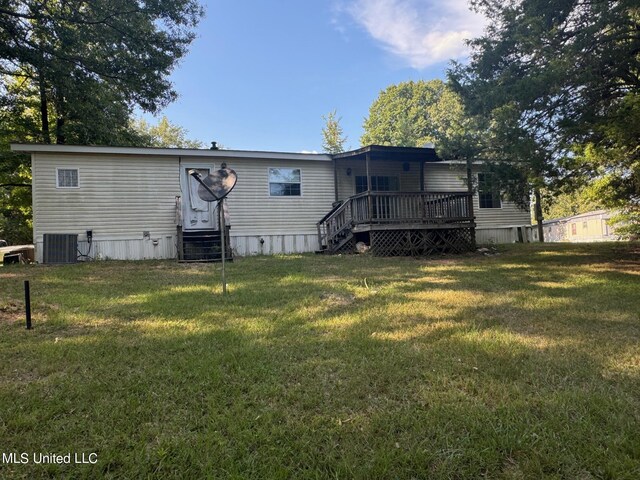 390 Green Rd, Yazoo City, MS 39194 - back of property featuring central air condition unit, a lawn, entry steps, and a wooden deck