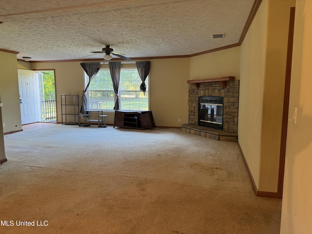 390 Green Rd, Yazoo City, MS 39194 - unfurnished living room with visible vents, carpet, a stone fireplace, and ornamental molding