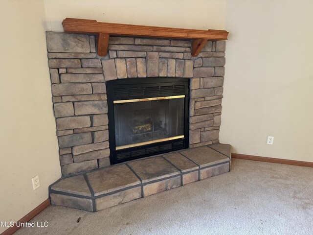 390 Green Rd, Yazoo City, MS 39194 - room details featuring a fireplace, baseboards, and carpet