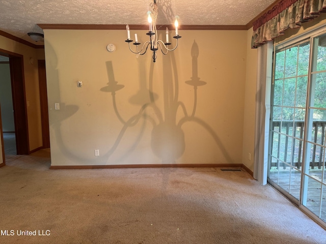 390 Green Rd, Yazoo City, MS 39194 - carpeted spare room featuring a textured ceiling, an inviting chandelier, baseboards, and ornamental molding
