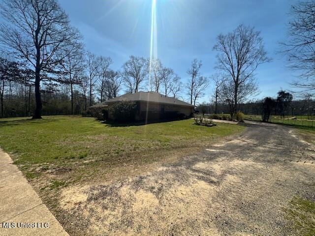 view of side of property featuring a lawn