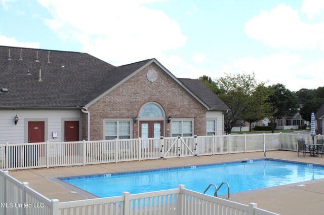 8855 Parkview Oaks Cir, Olive Branch, MS 38654 - community pool featuring a patio and fence
