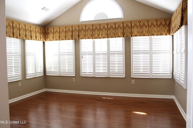 8855 Parkview Oaks Cir, Olive Branch, MS 38654 - unfurnished room with baseboards, vaulted ceiling, wood finished floors, and visible vents