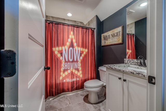 bathroom with visible vents, toilet, and vanity