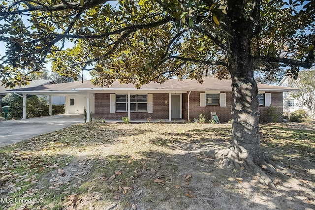 single story home with a carport