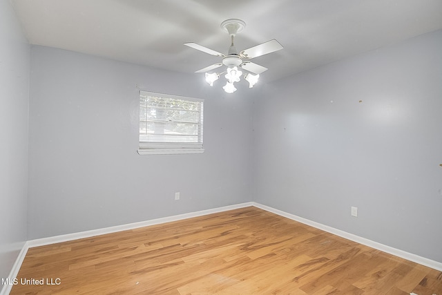 spare room featuring ceiling fan and hardwood / wood-style floors