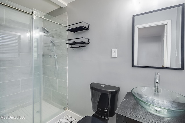 bathroom featuring vanity and an enclosed shower