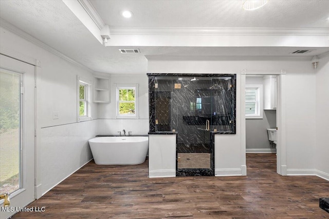 125 Lakeview Dr, Canton, MS 39046 - bathroom with ornamental molding, a marble finish shower, wood finished floors, and a freestanding tub