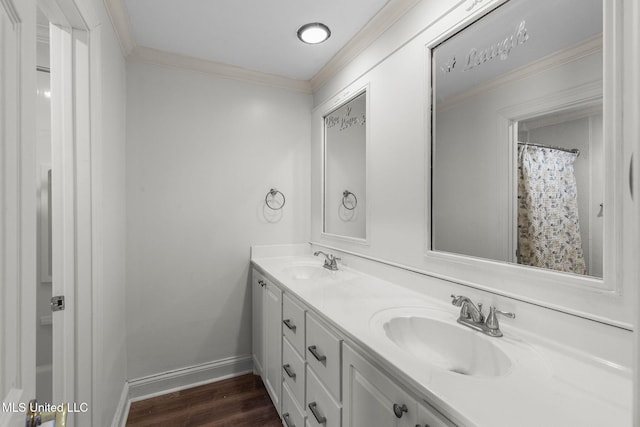 125 Lakeview Dr, Canton, MS 39046 - bathroom featuring crown molding, double vanity, wood finished floors, and baseboards