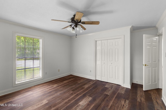 125 Lakeview Dr, Canton, MS 39046 - unfurnished bedroom with dark wood-style floors, baseboards, ornamental molding, a closet, and a ceiling fan